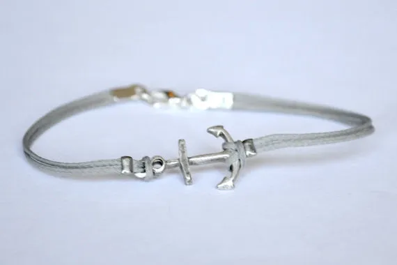 Cord bracelet with silver plated anchor charm, gray string