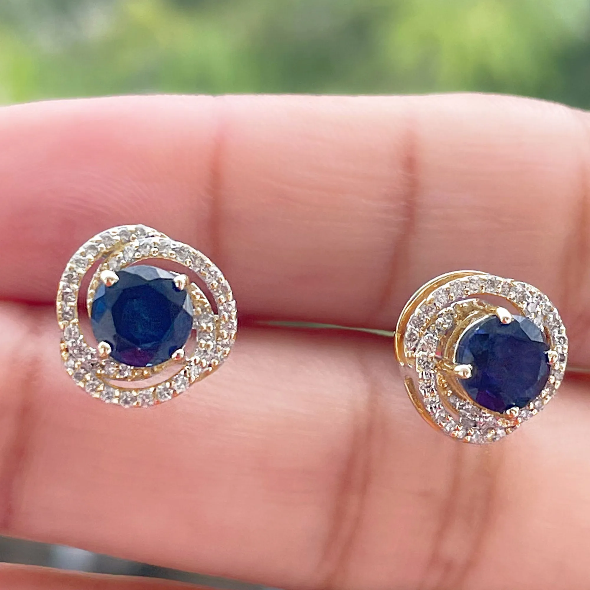 Created Blue Sapphire and Diamond Swirl Stud Earrings