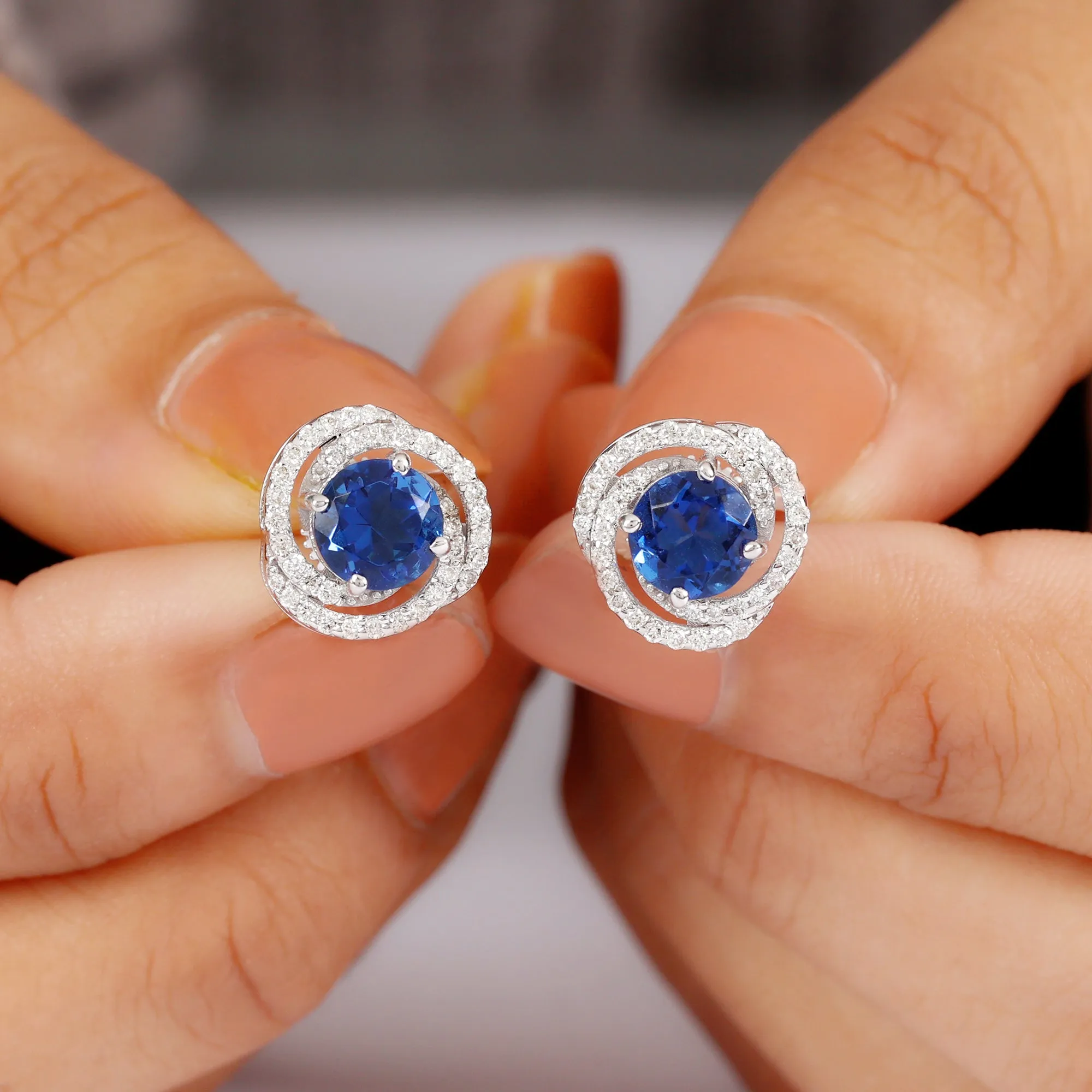 Created Blue Sapphire and Diamond Swirl Stud Earrings