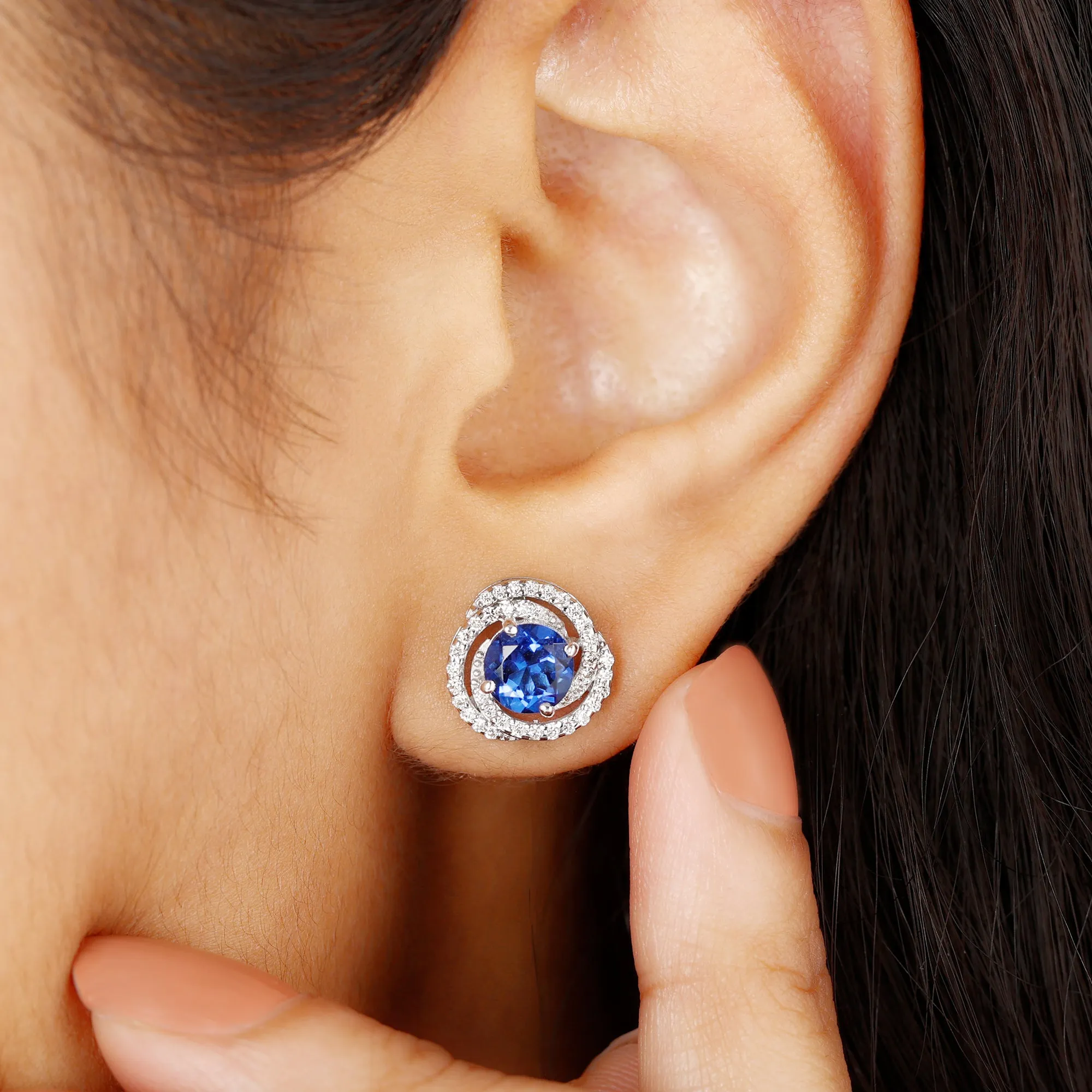 Created Blue Sapphire and Diamond Swirl Stud Earrings