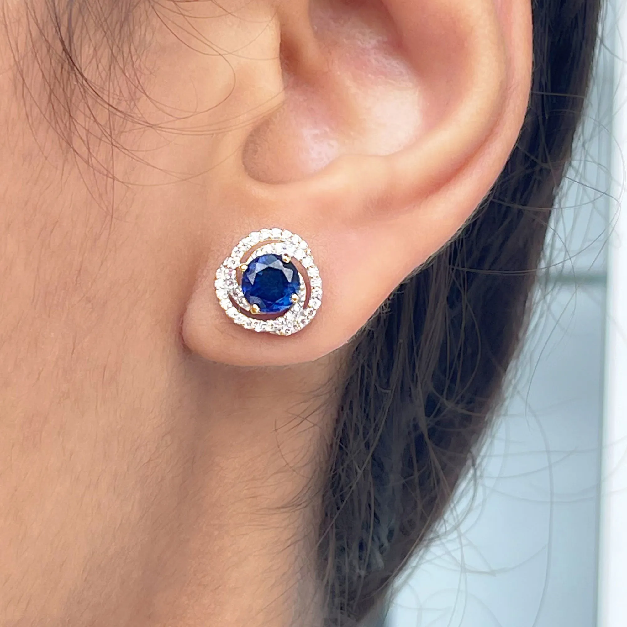 Created Blue Sapphire and Diamond Swirl Stud Earrings