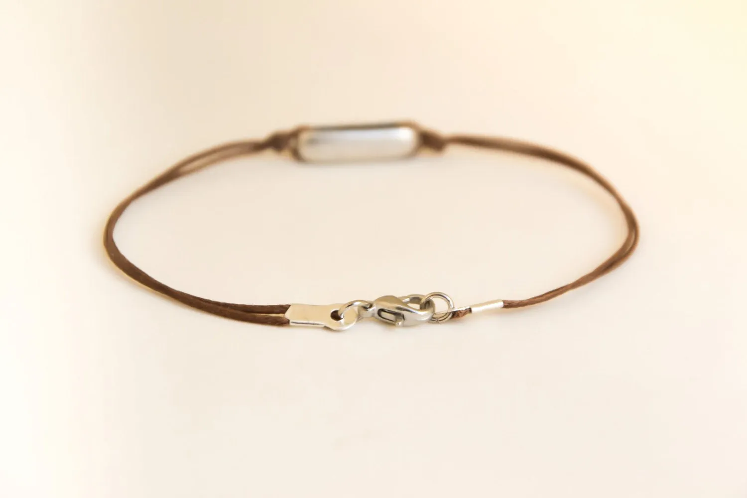 Men's bracelet with a silver rectangle bead, Brown cord