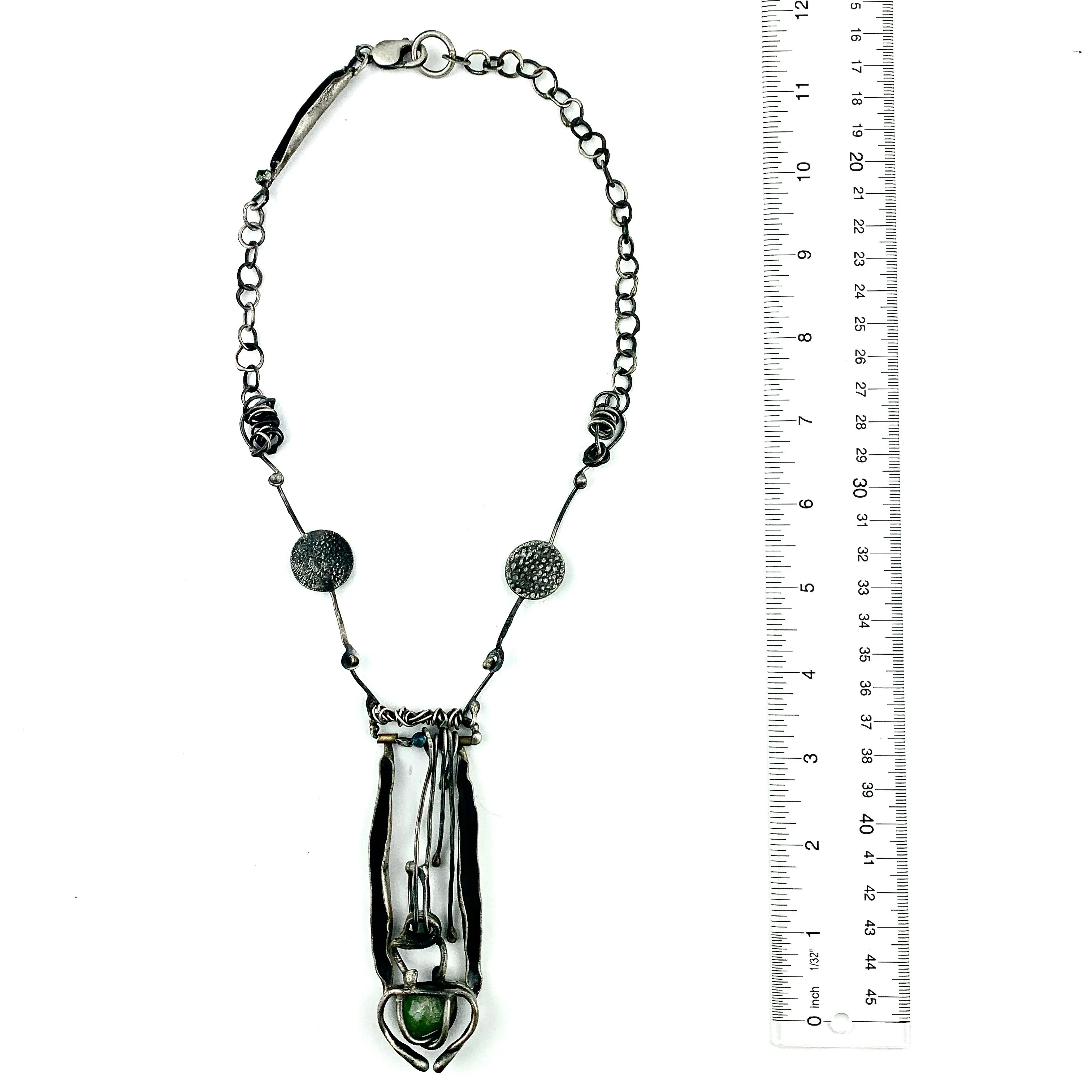 Sculptural Necklace with Blue Topaz and Caged Green Rough Stone